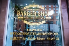 Outside Barber City Barber Shop on W 57th St.