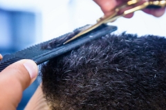 Cutting men's hair at Barber City Barber Shop